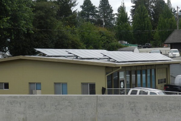Three rows of photovoltaic solar panels in Milwaukie, Oregon