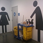 cleaning cart next to restrooms